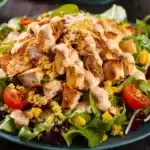 A delicious Southwest Chicken Salad displayed on a blue ceramic plate.